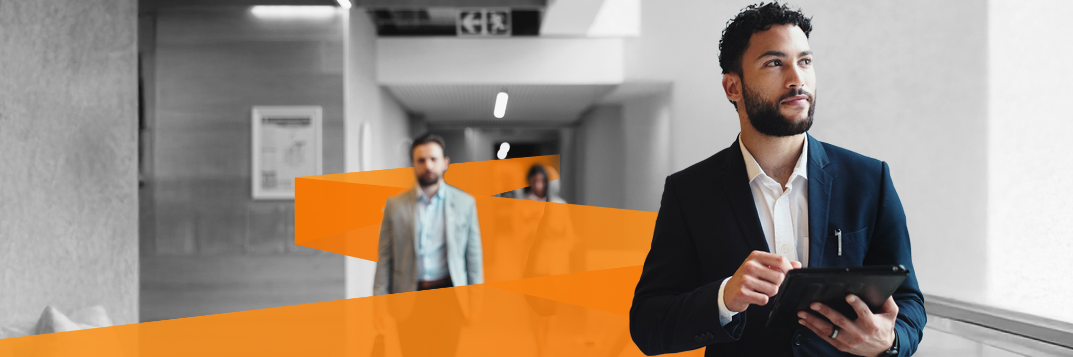Man walking down office hallway: Give your enterprise a real edge