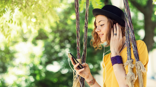 Girl in black hat on tree swing Card Hero - 500 x 281