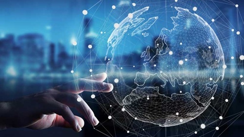 Human hand gesturing at projected image of the Europe with scattered data points over the backdrop of a city's horizon